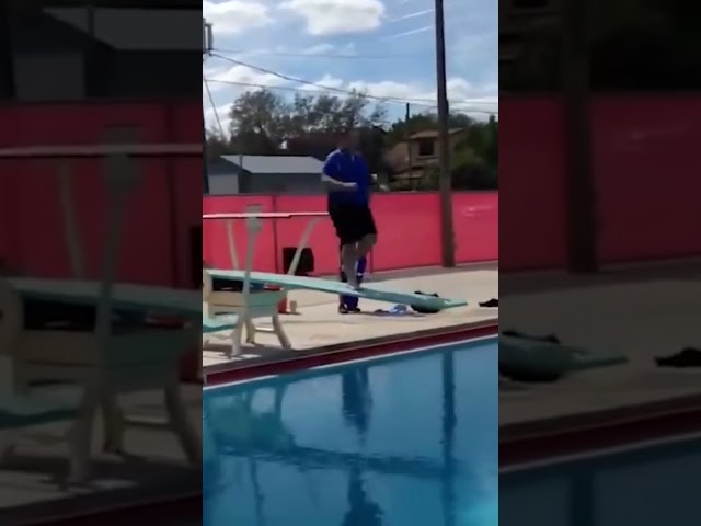 Fail: Man falls from springboard into pool. #shorts #fail