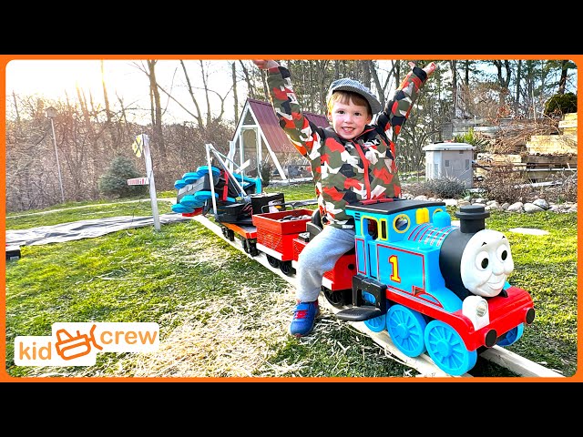 Driving train on backyard railroad to deliver straw and rescue locomotive. Educational | Kid Crew