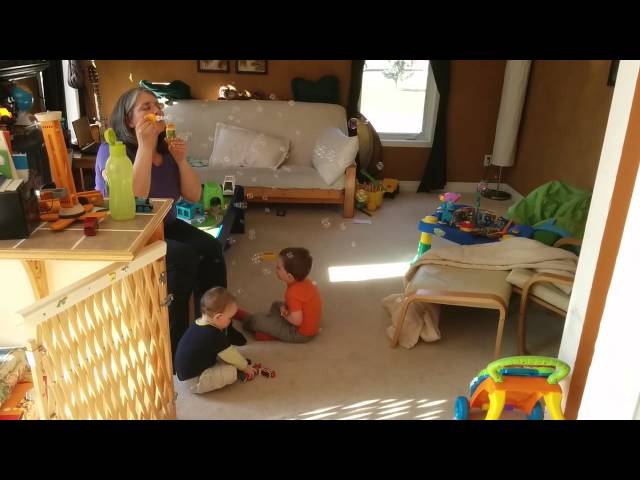 Daniel and James playing with bubbles