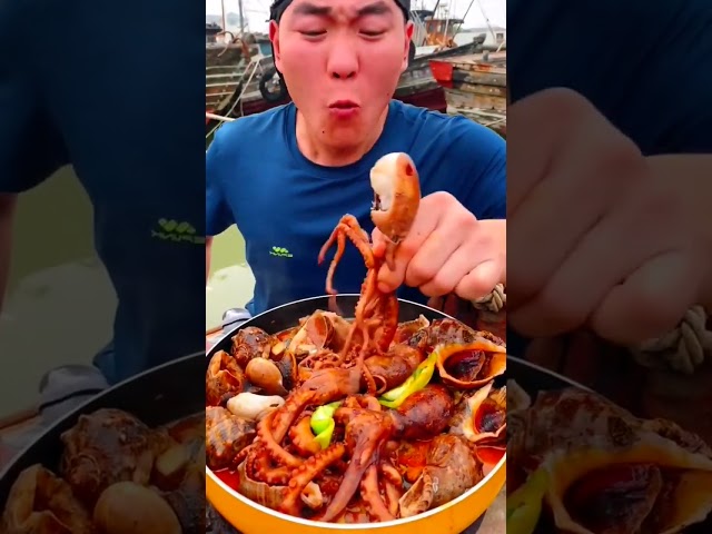 Chinese fisherman cooking and Eating fresh seafood...