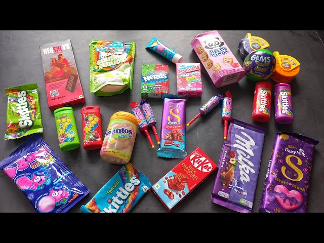 100 candies opening, chocolate a video, lots of chocolates, Cadbury celebration, surprise toys