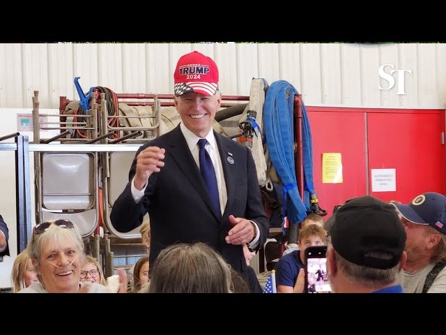 Biden’s Trump hat gesture wins cheers from crowd