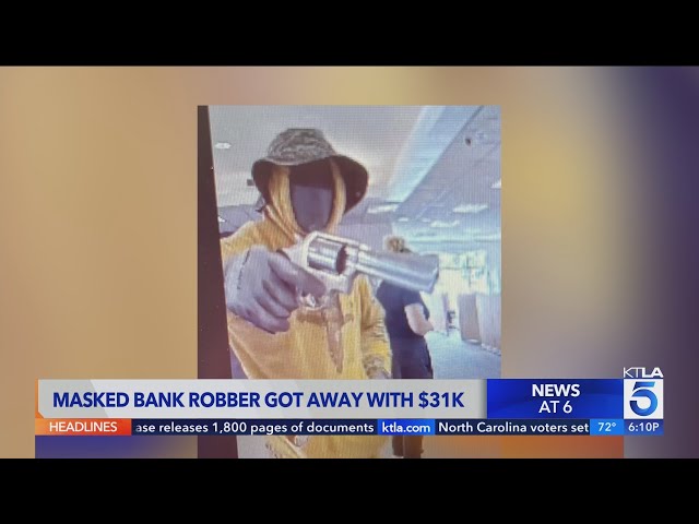 Authorities search for armed suspect in Orange County bank robbery