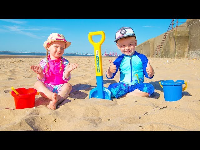 Gaby and Alex playing on the Beach with Sand and other Kids Toys