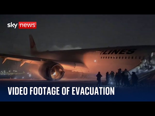 New footage of passengers evacuating burning plane in Japan