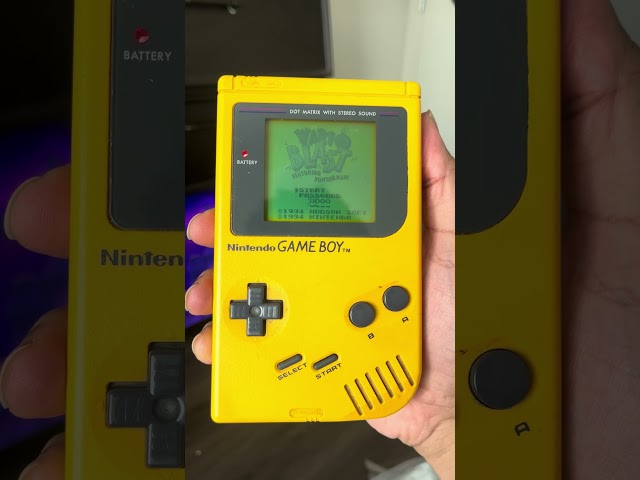 The original Nintendo game boy ￼￼yellow from the ￼90s￼ old school ￼