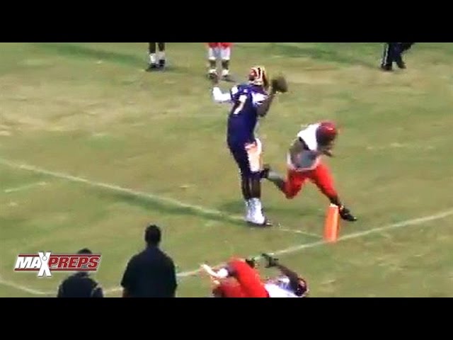 Louisville recruit Lamar Jackson walks into the end zone