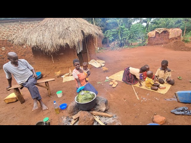 African village life of three women in one hut  cooking corn and tea for their husband and children