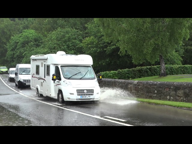 Vehicles Driving Through Flooding A93 Road Perthshire Scotland