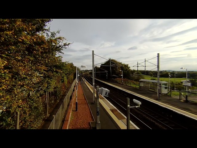 Local train followed by Transpennine express on 2024-10-05 at Carluke on Calf Visinse VR180