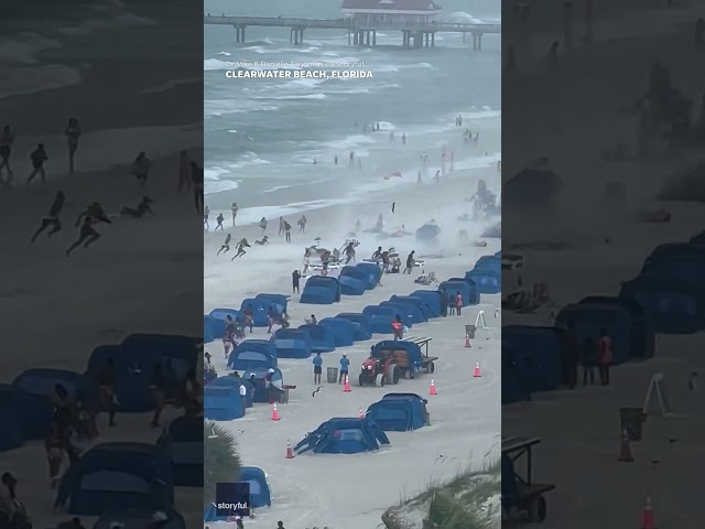 Footage captures waterspout ripping through crowded beach #Shorts