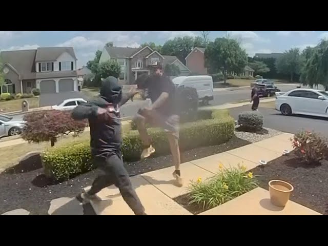 Dueling porch pirates fight to steal package outside home