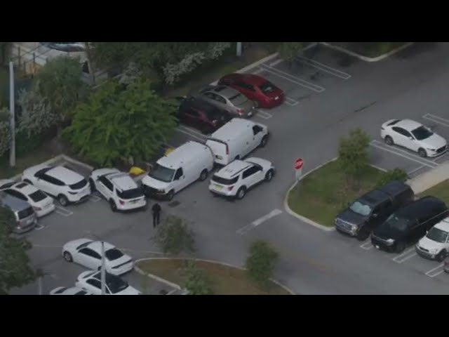 Residents react after a woman was found shot to death in a parking lot in Miami | Quickcast