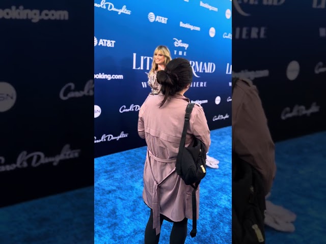 Heidi Klum walks the blue carpet at the little mermaid premiere 2023