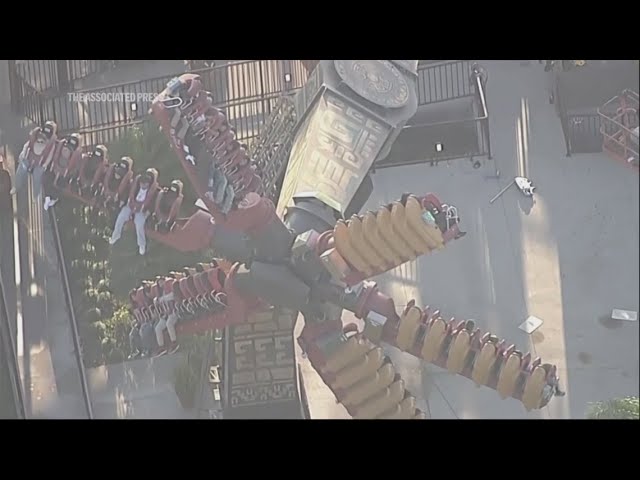 Riders suspended mid-air after amusement park ride malfunctions