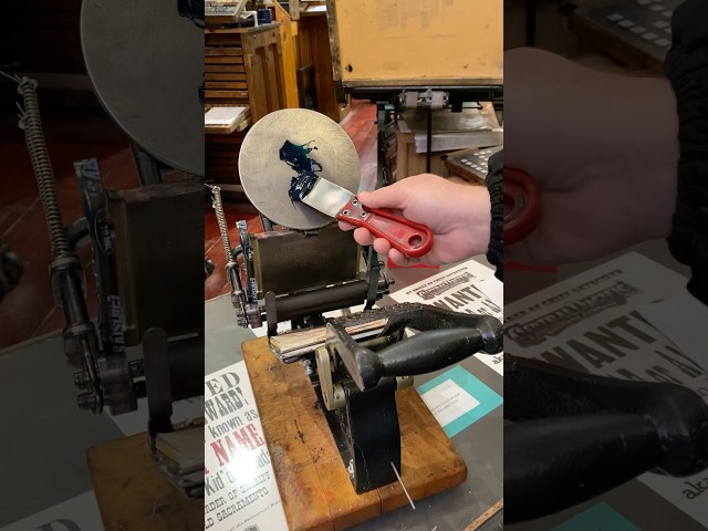 Letterpress printing a frog on a penny farthing using a tabletop printing press