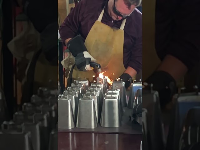 Watching people weld cowbells for Mississippi State fans in slow motion