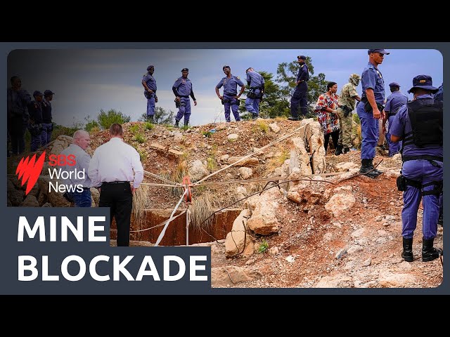 Stand-off at a disused mine in South Africa, where thousands remain stuck