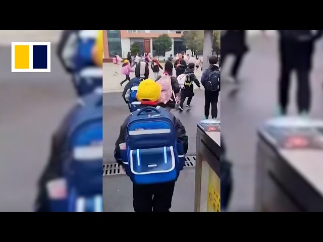 Car crashes into crowd outside Chinese primary school