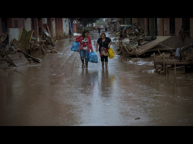 Residents in Spain cleaning up towns after devastating floods