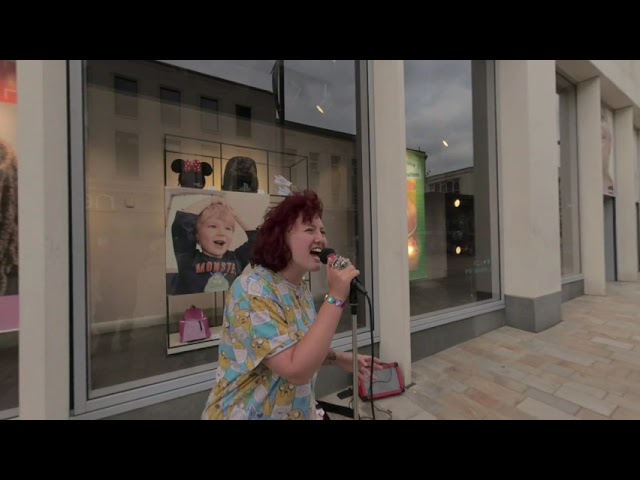 VR180° Good female singer, busking on the Moor, Sheffield