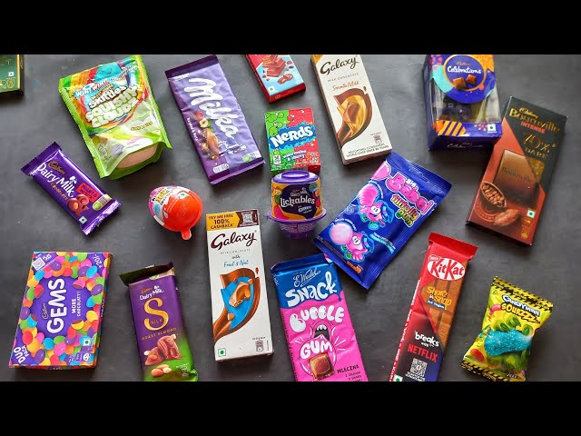 100 candies opening, chocolate a video, lots of chocolates, Cadbury celebration, surprise toys