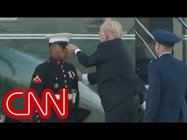 Trump stops to retrieve Marine's hat