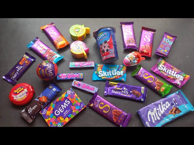 100 candies opening, chocolate a video, lots of chocolates, Cadbury celebration, surprise toys