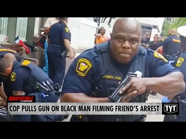 WATCH: Cop Pulls Gun On Black Man Recording Friend's Arrest