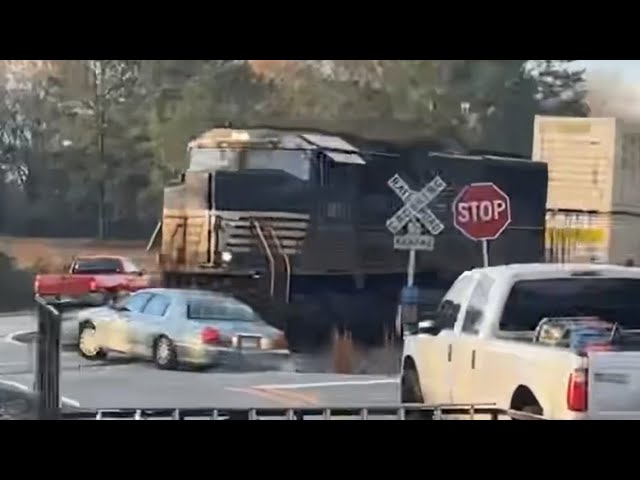 Raw video: Train crashes into car in Georgia as driver escapes just before impact.