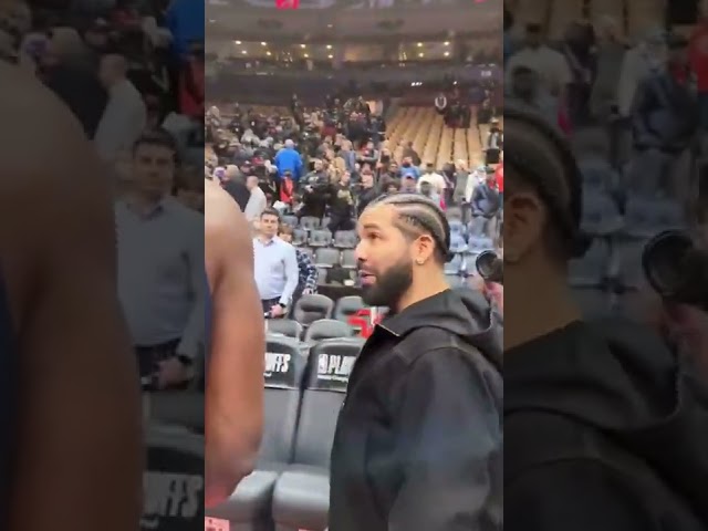 Drake getting walked out the arena by Joel Embiid 🧹🧹🧹